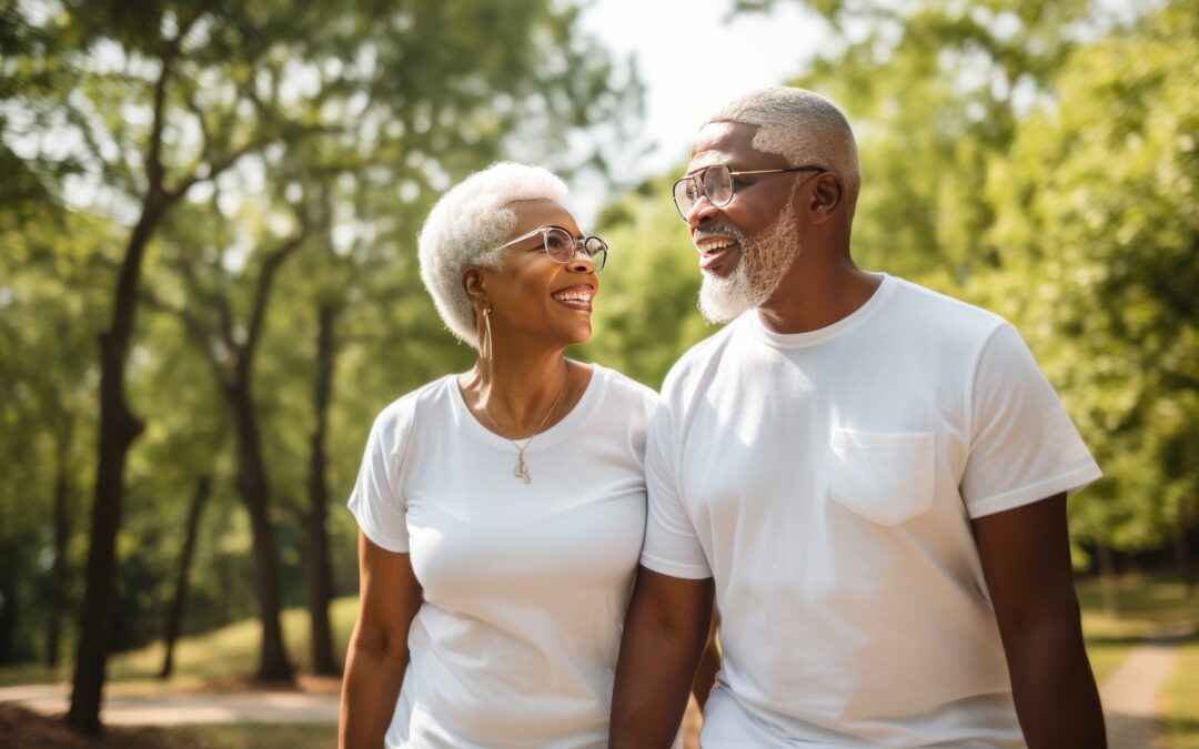 Old black couple walking in the park