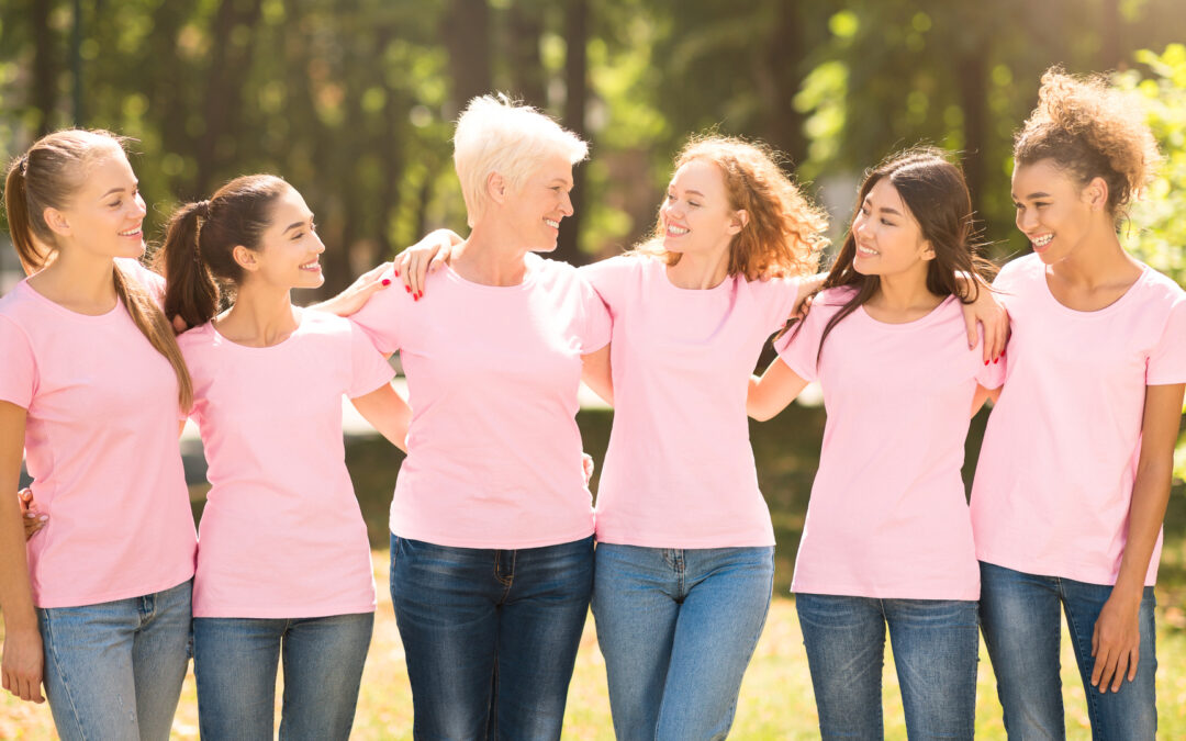 Breast Cancer Volunteers. Women In Pink Ribbon Awareness T-Shirts Embracing Standing Outdoor. Panorama