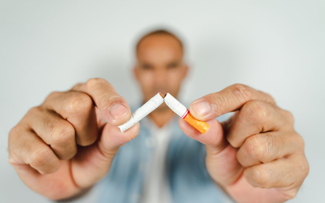 Man hand crushing cigarette, Concept Quitting smoking,World No Tobacco Day.